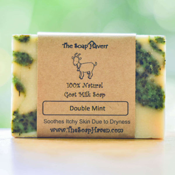 The Soap Haven Double Mint Goat Milk soap bar with a label that says " Soothes itchy skin due to dryness".