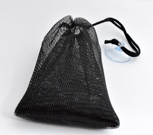 The Soap Haven black soap saver mesh bag with a black drawstring cord and a clear plastic suction cup for soap bar.